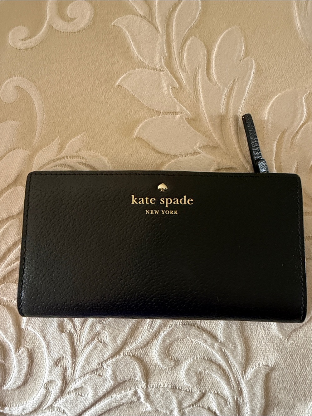 kate spade black leather zip-around wallet with gold logo like new used once